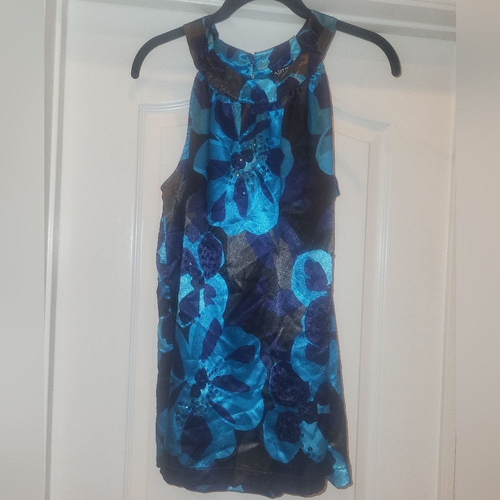 Beautiful top with sequin embellishments. satin feel.